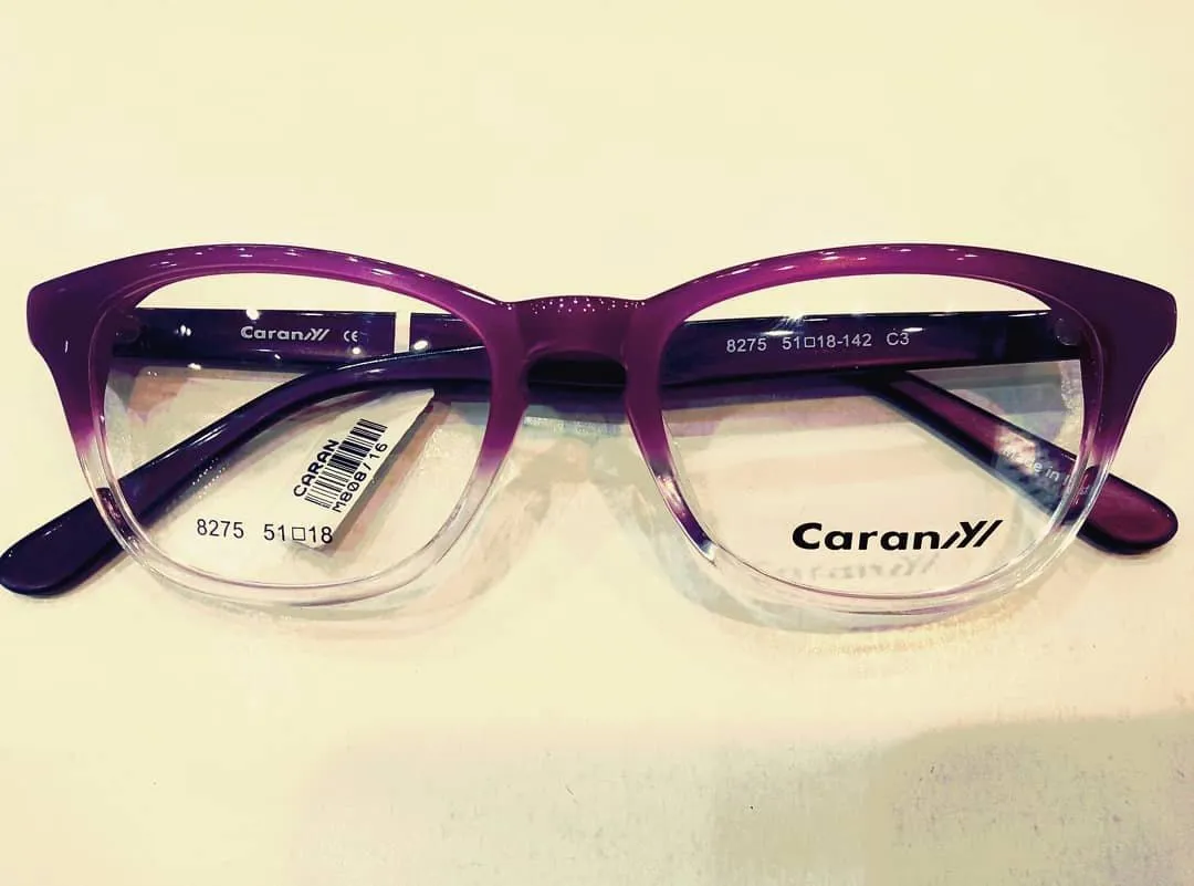 Violet acetate glasses fading to clear at the lower rim