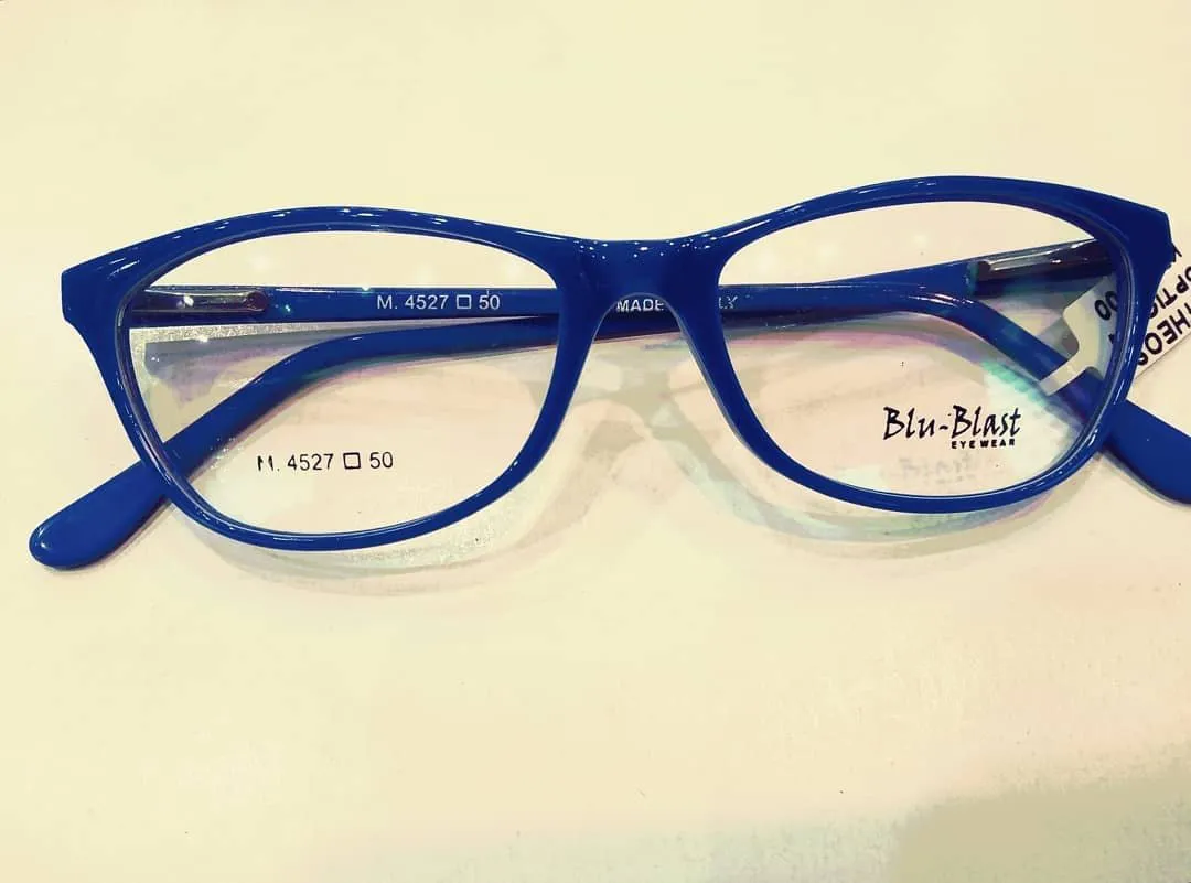 Cobalt blue acetate frame on a cream counter